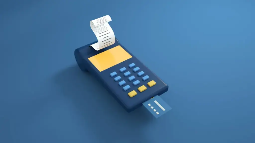 Um leitor de cartão azul com um comprovante impresso e um cartão inserido sobre um fundo azul.